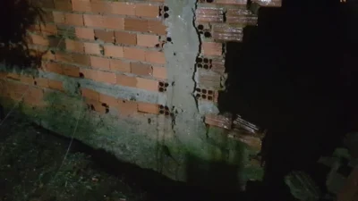 Chuva ocasiona queda de muro e deslizamento