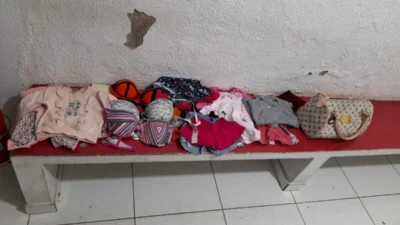 Suspeito com bolsa de marca é levado para a Delegacia