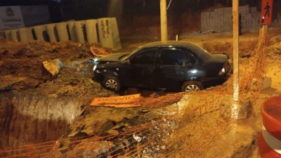 Vítimas ficam feridas após carro cair em buraco de obra da ‘Ponte do Baguá’